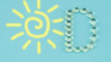 Güneş ve D vitamini harfi şeklindeki D'nin bulunduğu bir görüntü 